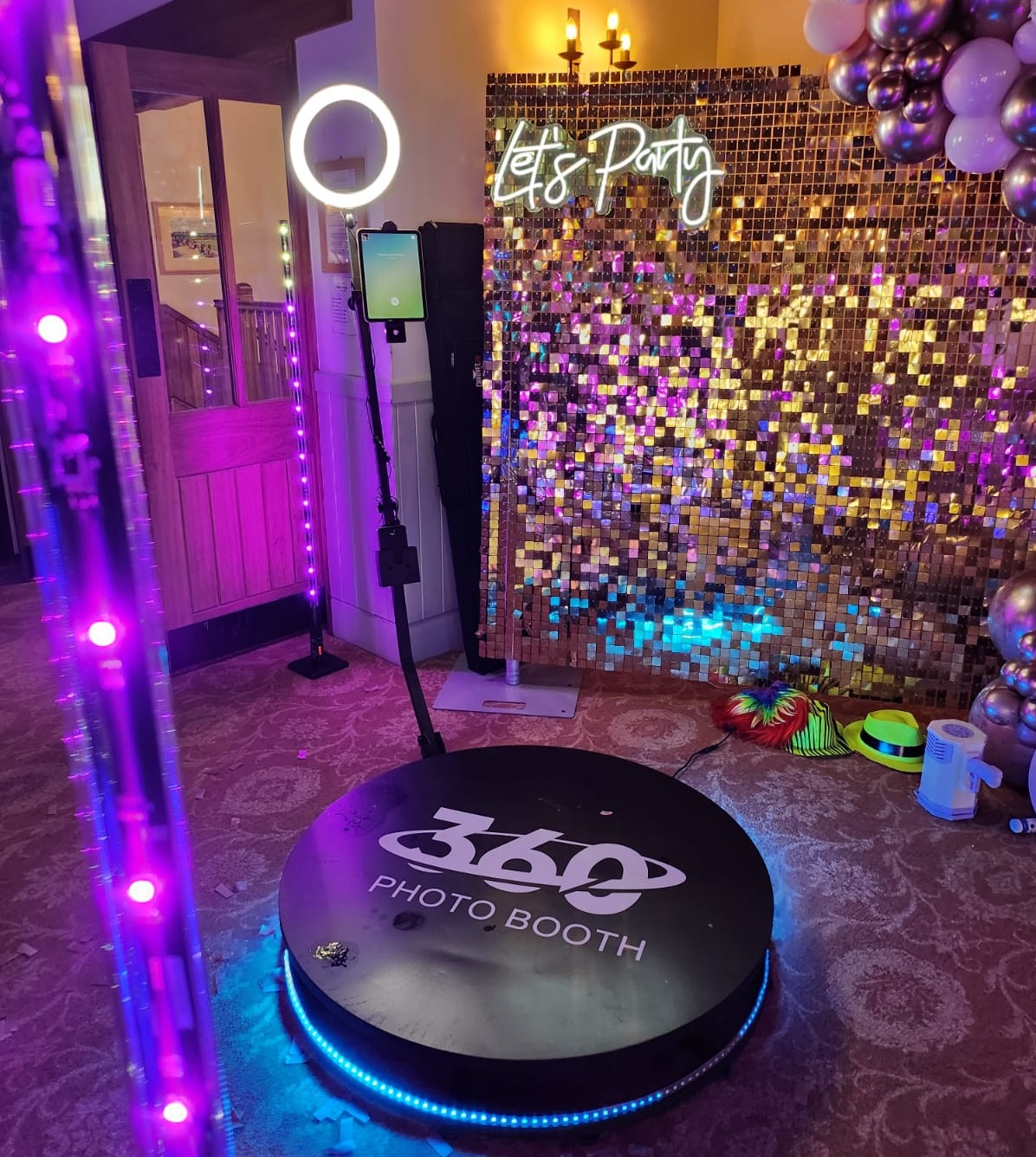 A corporate logo branded on the 360 booth platform.